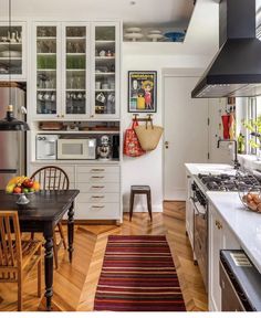 the kitchen is clean and ready for us to use as a dining room or office