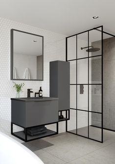 a bathroom with a sink, mirror and shower stall