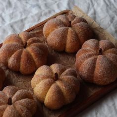 some sugared buns are sitting on a tray