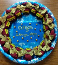 a birthday cake decorated with candy and candies on a blue plate that says, ginger you