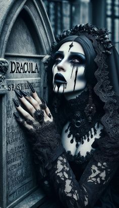 a woman dressed in black and white with her hands on the grave, wearing gothic makeup