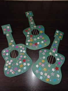 three ukulele shaped like stars on a table