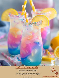 two glasses filled with liquid and topped with lemon wedges next to sliced lemons