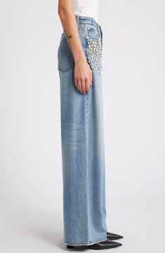 Hand-sewn jewels cascade from the front pockets on these high-waisted jeans crafted from lightweight denim in a wide-leg silhouette. 32" inseam; 25" leg opening; 12 1/4" front rise; 15" back rise (size 29) Zip fly with button closure Five-pocket style 61% cotton, 39% Tencel® lyocell Tencel lyocell is a more-sustainably produced fiber made with closed-loop processing Hand wash, line dry Imported High Waist Wide Leg Jeans, Rhinestone Jeans, Jean Crafts, Rag & Bone, Wide Leg Jeans, Hand Sewn, High Waist Jeans, Leg Jeans, Hand Sewing