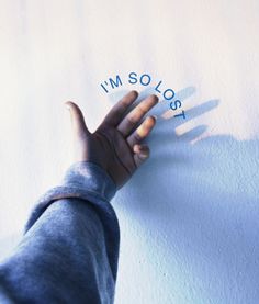 a person's hand on top of a white sheet that says i'm solosy