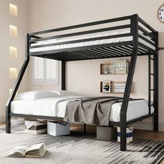 a black bunk bed with a white mattress underneath it and an open book on the floor