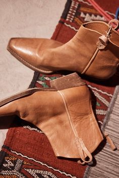 Your new go-to boot all season long, these western-inspired leather boots from our We The Free collection are featured in a short silhouette with square pointed toe and contrast sole for added dimension. * Back zip closure * Hand-stitched detailing throughout * Unique studded bottom sole * Specially designed side tabs**Fit tip:** This style runs true to size, if in between sizes; we suggest sizing up. Western Ankle Boots Outfit, Black Western Boots Outfit, White Western Boots Outfit, Western Boot Outfit, Western Boots Outfit, Black Western Boots, Ankle Cowboy Boots, Boots Outfit Ankle, Western Ankle Boots