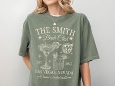 a woman wearing a t - shirt that says the smith back out in las vegas nevada