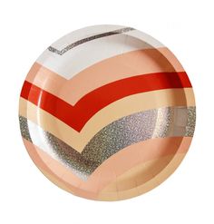 a paper plate with an orange, pink and silver striped design on the bottom is shown