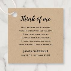 a card with the words think of me on it and a tag attached to it