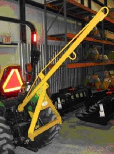 there is a large yellow crane in the garage