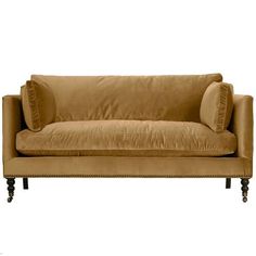 a brown couch sitting on top of a wooden frame