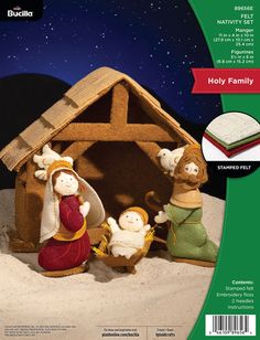 the nativity kit includes three figurines and a manger