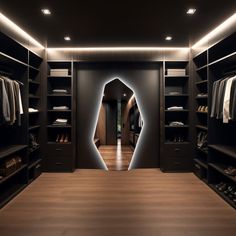 a walk in closet with lots of clothes