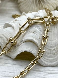 Description: U link chain, U Shape Chain, U link Ball Chunky Statement Chain, Bulky Link chain 2 sizes, 4 Finishes. Plated Zinc Alloy. Fast Ship Choose color from drop down menu. Gold Silver Gunmetal Matte Gold Large 15mm long x 9mm wide - 3.8mm thick Small 9.75mm long x 5mm wide - 2.5mm thick Lead free, nickel free Unsoldered/ open links makes it great for mixing chain colors and large jump rings. All quantities are by the foot. www.instagram.com/blingbya/ Matte Gold, Jump Rings, Base Metal, Metal Chain, Link Chain, Zinc Alloy, Silver Gold, Product Description, Plating