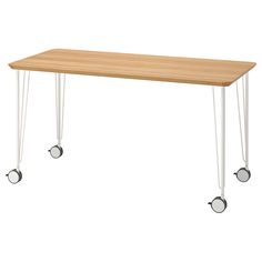 a wooden table with white legs and two wheels on each side, against a white background