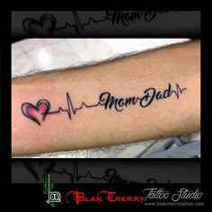 a man's arm with a heartbeat tattoo and the words memory dad on it