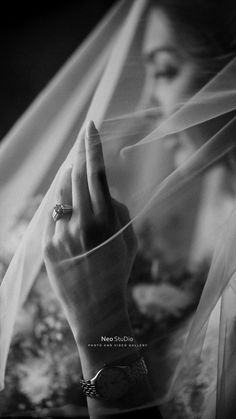 black and white photograph of a woman wearing a veil