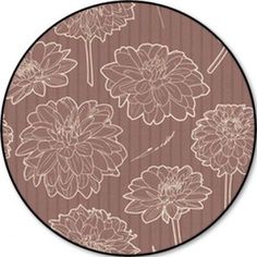 a brown and white flower pattern on a round rug