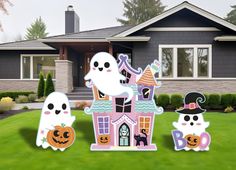 halloween yard decorations in front of a house with ghost and pumpkins on the lawn