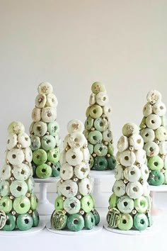 there are many donuts stacked on top of each other in the shape of trees