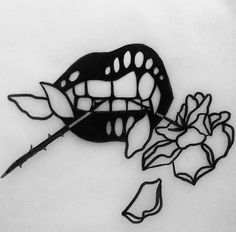 a black and white photo of a mask with flowers