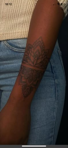 a woman with a tattoo on her arm