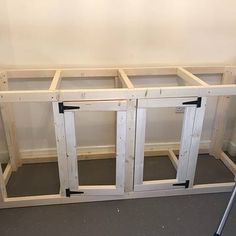 an unfinished kitchen cabinet is being built with the doors open and ready to be installed