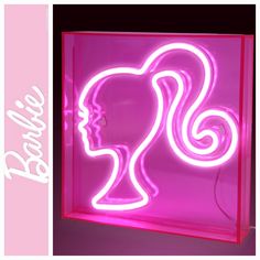 a pink neon sign with a woman's head