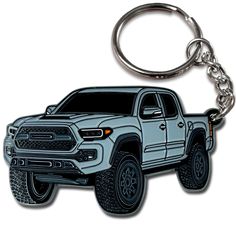 a keychain with a white truck on it's front and back sides