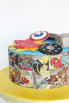 a birthday cake decorated with comic characters