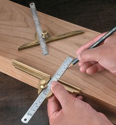 a person is measuring the length of a piece of wood