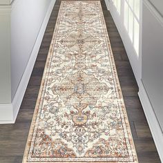 a long rug is on the floor in a hallway