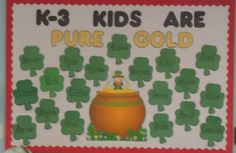 a bulletin board that says k - 3 kids are pure gold with shamrocks on it