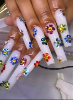 white flower rhinestone nails| rhinestone flower nail| multiple color, luxury nails, vacation nails Nail Design With Jewels, Polygel Nails Ideas Easy, Xl Stilleto Acrylic Nails, Nail Inspo Square Long, All Glitter Nails, Nail Ideas Y2k Long, Birthday Sets Nails, Boujie Nails, Baddie Birthday Nails