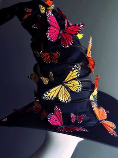 a hat with many butterflies on it