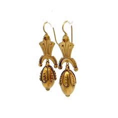 Step back in time with these exquisite Victorian drop earrings, truly a treasure from the 19th century. Crafted in 15 karat yellow gold, these antique earrings showcase the ornate detailing characteristic of the Victorian era. Each earring features intricate scrollwork and hollow elements that contribute to their lightweight feel, making them comfortable for all-day wear. These elegant drop earrings are perfect for anyone who appreciates the beauty of antique jewelry and the rich stories they hold. A timeless set of earrings that add a touch of history and elegance to any outfit! Luxury Victorian Yellow Gold Pearl Earrings, Luxury Yellow Gold Victorian Pearl Earrings, Classic 22k Gold Hallmarked Earrings, Classic Hallmarked 22k Gold Earrings, Historical Yellow Gold Drop Earrings, Antique 14k Gold Hallmarked Earrings, Yellow Gold Historical Drop Earrings, Yellow Gold Drop Earrings With Historical Design, Classic 22k Gold Earrings