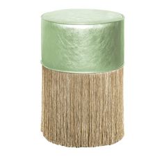 a green stool with fringes on the bottom and a leather top, sitting on a white background