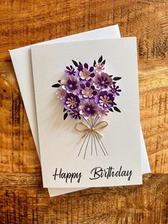 a birthday card with purple flowers on it