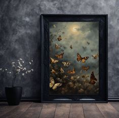 a painting with many butterflies flying in the sky above it and a potted plant next to it