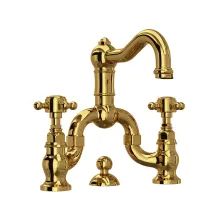 an antique style faucet with two handles and three spouting holes in polished brass