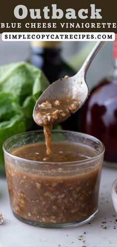 a spoon with some food in it on top of a table