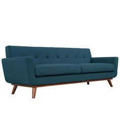 a blue couch sitting on top of a wooden frame