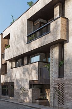 an apartment building with balconies on the second floor