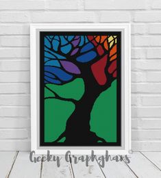 a colorful tree on a white brick wall in front of a wooden floor with the words,