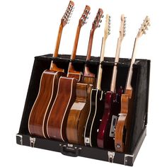 an assortment of guitars in a black case