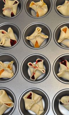 some dumplings are sitting in a muffin tin