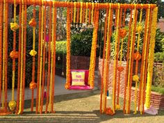 an outdoor ceremony with orange and yellow decorations