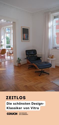 a living room with hard wood floors and white walls