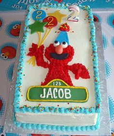 the birthday cake is decorated with sesame street characters